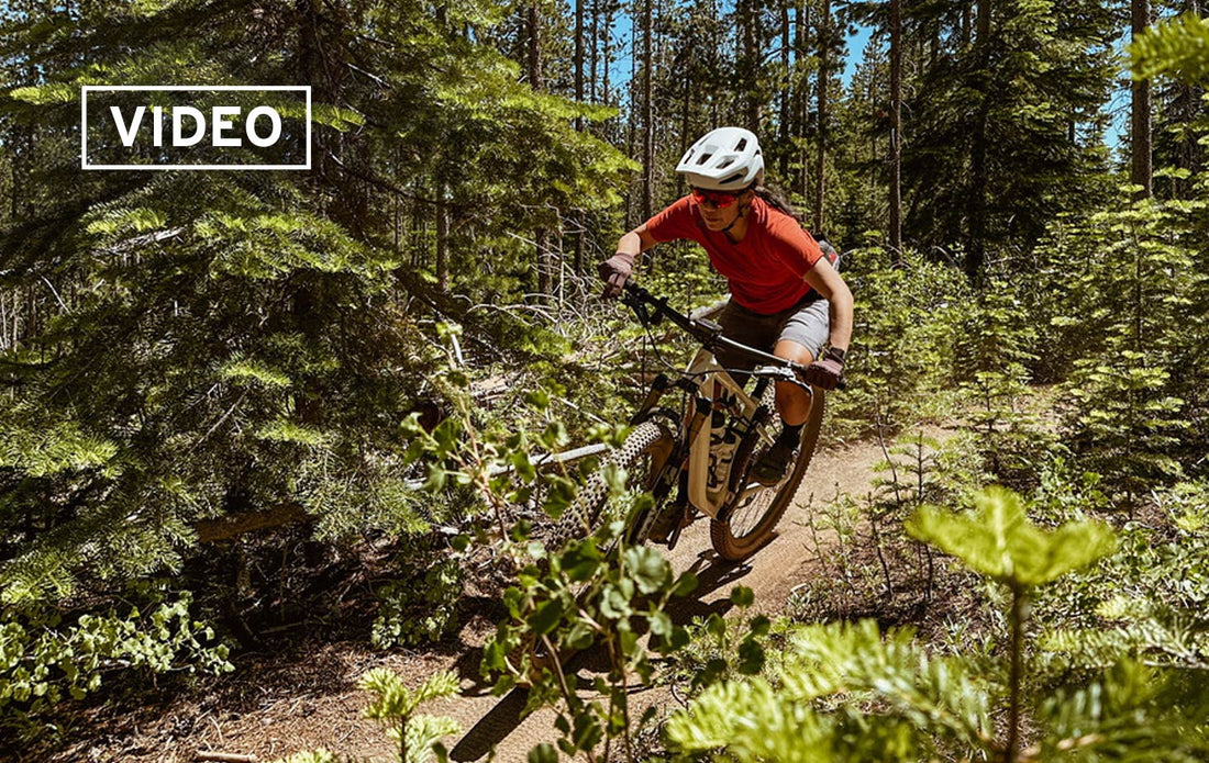 woman mountain biker rides in the trees in Bend, OR