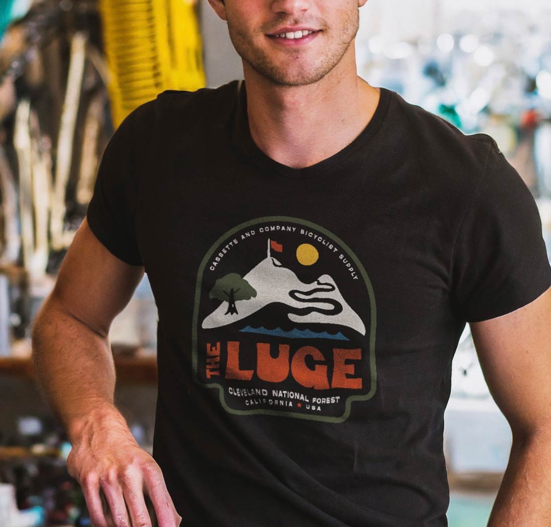 man wearing black Luge t-shirt with 4 color print
