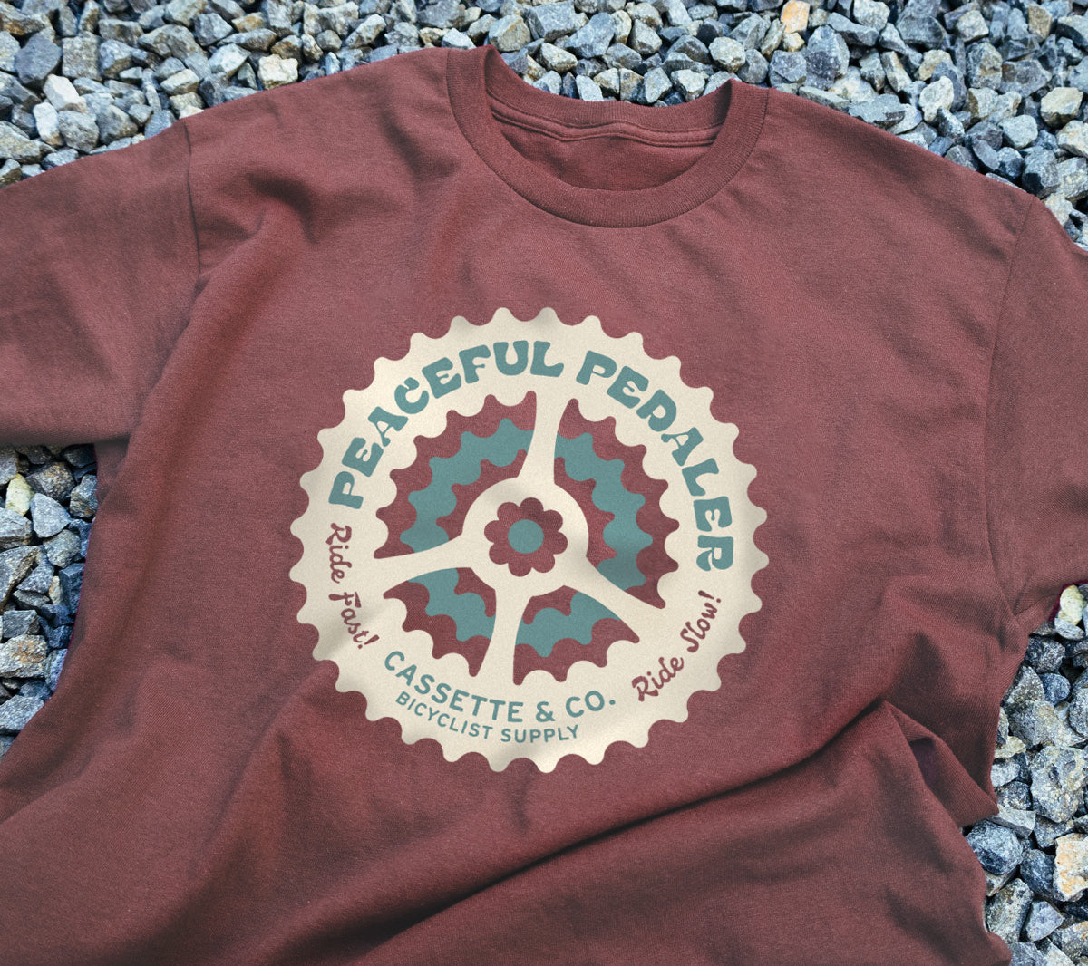close up detail of peaceful pedaler tee on rocks